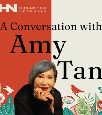 Image of Amy Tan resting her head in the palm of her hands