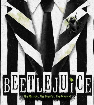 Black and white striped suit with a black beetle on the front and the word Beetlejuice displayed across the bottom