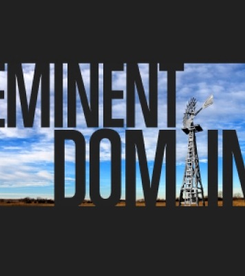 Eminent Domain text written across the image and a windmill posing as the i in Domain